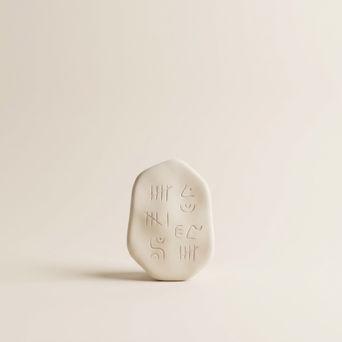 Porcelain stone tablet with carved marks